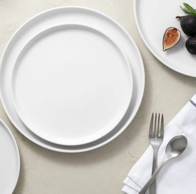 Public-Goods-Eco-friendly-plates-displayed-on-table-with-silverware