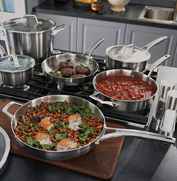 Image of complete Calphalon Premier Stainless Steel Collection displayed on countertop