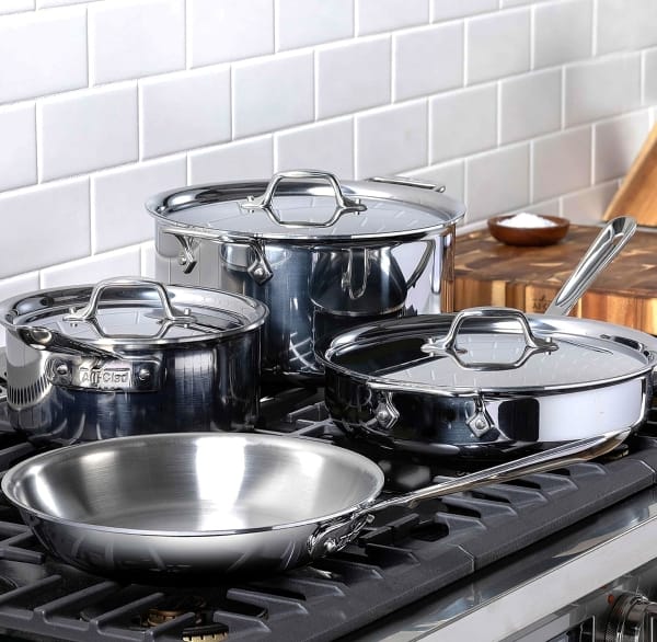 All-Clad D3 assortment sitting on gas stove