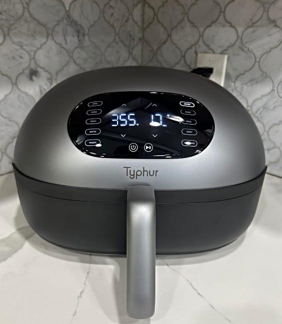Image of the Typhur ceramic air fryer sitting on white marble countertop