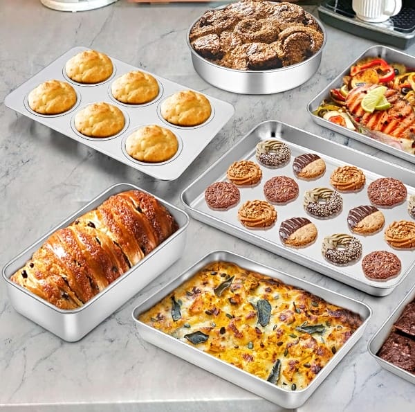 teamfar stainless steel bakeware assortment on table with various baked goods fresh out of the oven such as breads and muffins